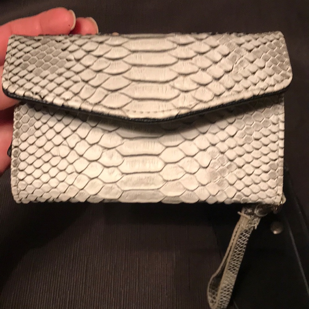 2 wristlets black one is Chaps brand white Walmart